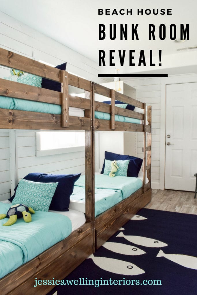 Beach House Bunk Room Reveal! image of 4 bunk beds with aqua colored bedding and a navy blue fish rug