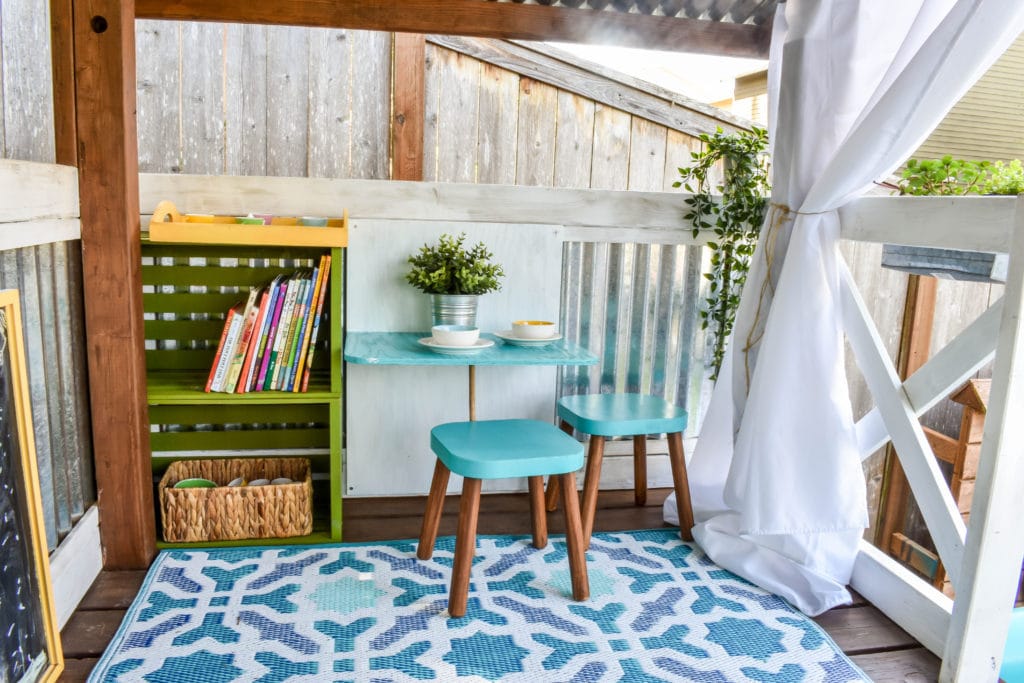 image of playhouse makeover with mini table and stools