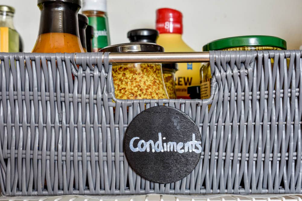 This small organized pantry closet  on a budget with shelves and baskets is full of cheap and easy ideas to keep all your food visible and easy to access!