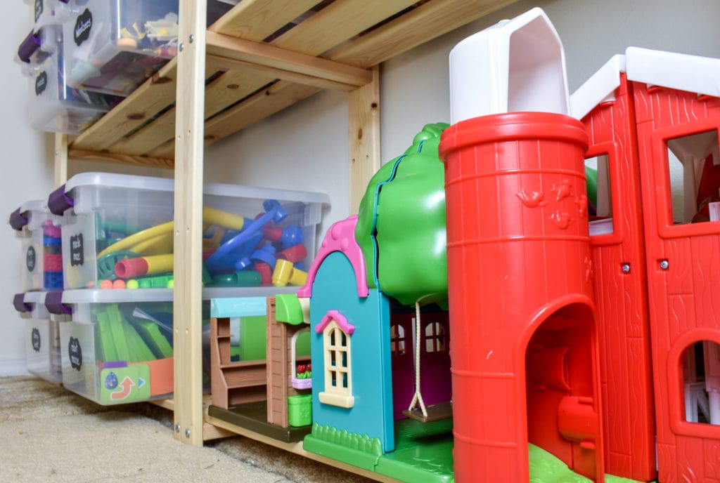 photo of organized toy closet with 'Lil Woodzeez houses in the foreground