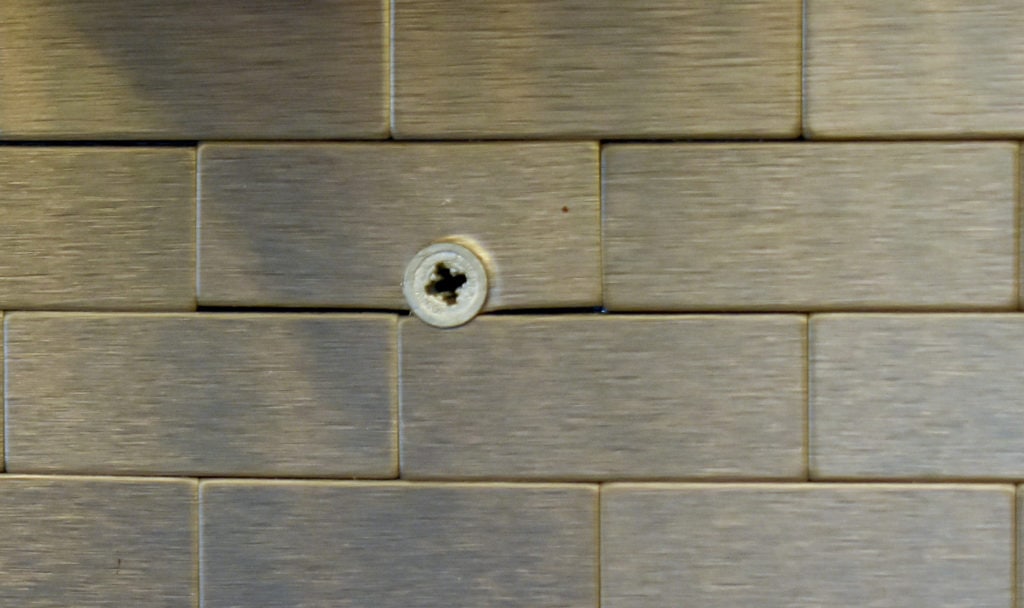 photo of stainless steel backsplash with anchor