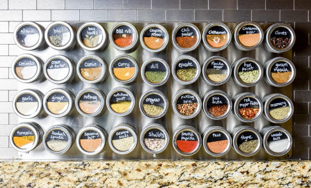 large DIY spice rack with magnetic spice jars