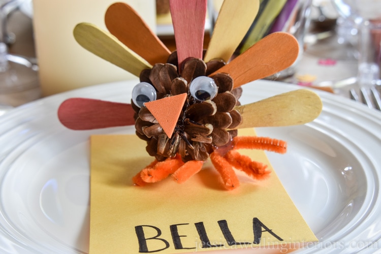 image of pine cone turkey on Thanksgiving kids table