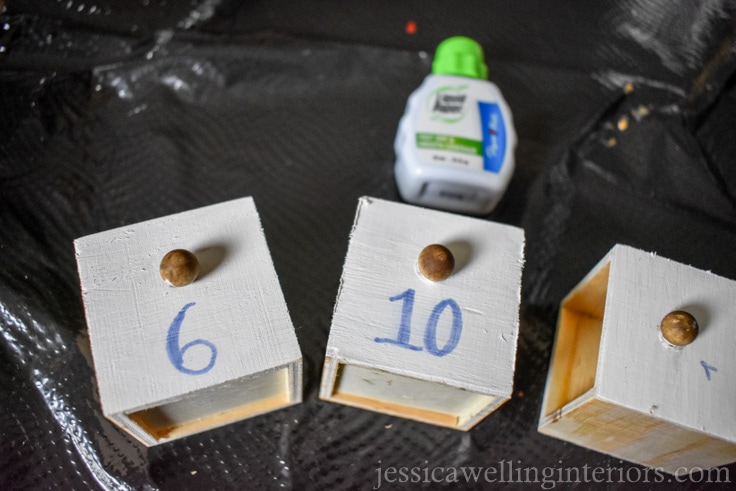 mini drawers from wood advent calendar being painted white