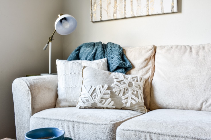 Take your living room decor from Christmas to cozy for Winter with these simple Winter decorating ideas! It's all about throw pillows, throw pillow covers, and throw blankets.