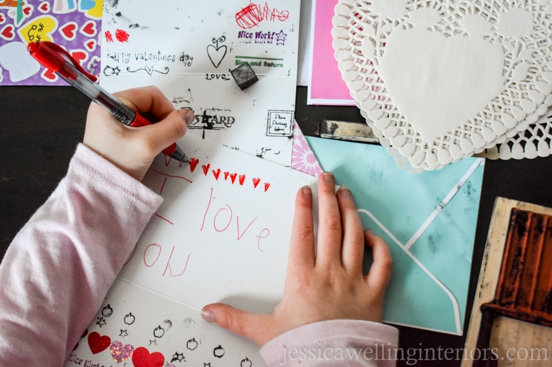 image of child making valentines in play post office
