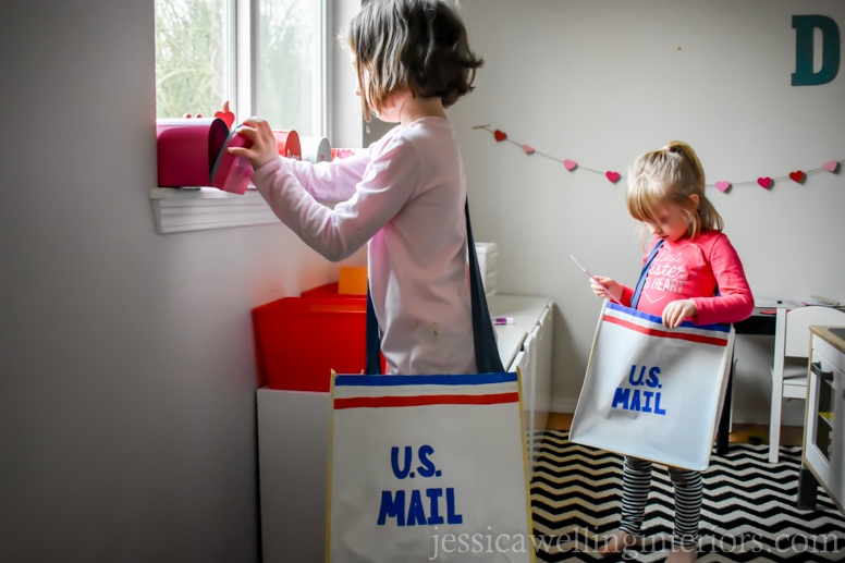 image of children delivering mail in play post office for Valentine's Day