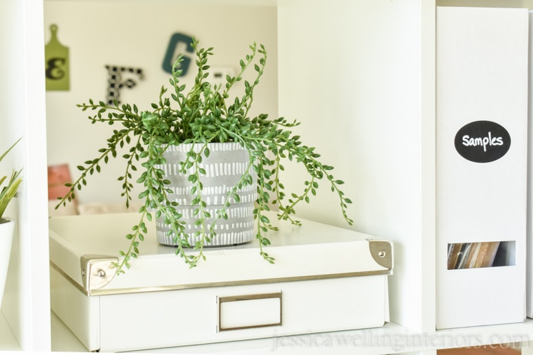 close-up of ikea kallax bookshelf with box and indoor plant in nypon pot