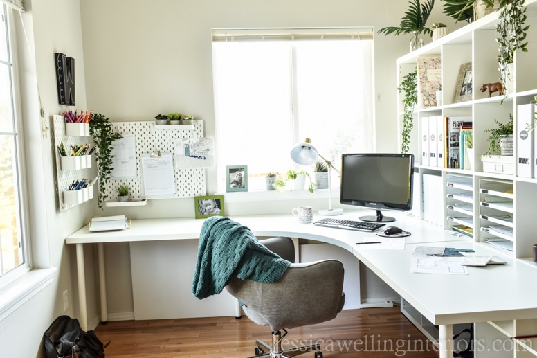 This Ikea home office makeover on a budget features the Kallax bookshelf as a room divider, a Linnmon table desk hack, a comfy chair, pegboards, and more!
