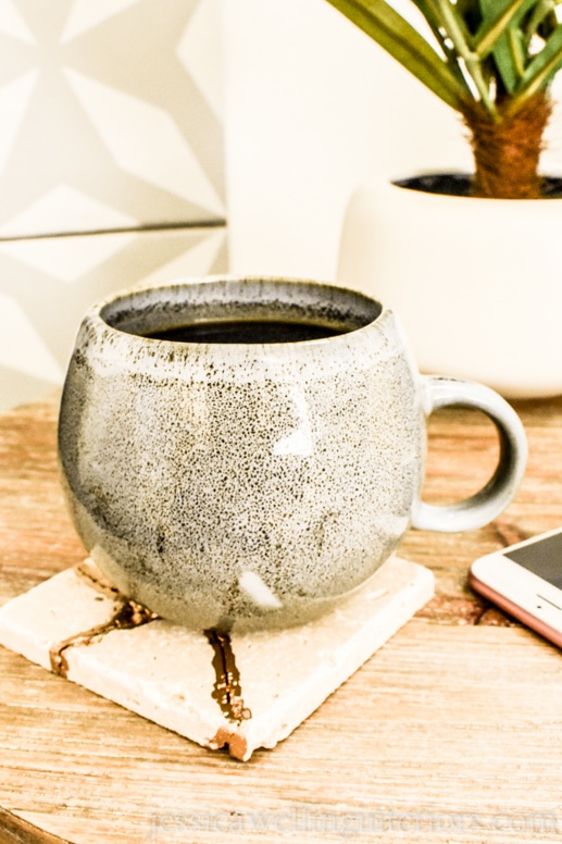 image of mug on end table with kintsugi tile coaster