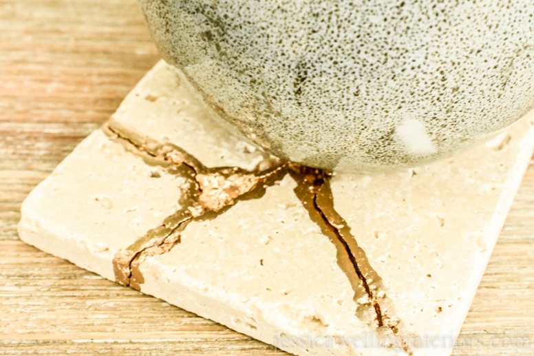 image of mug on end table with kintsugi tile coaster