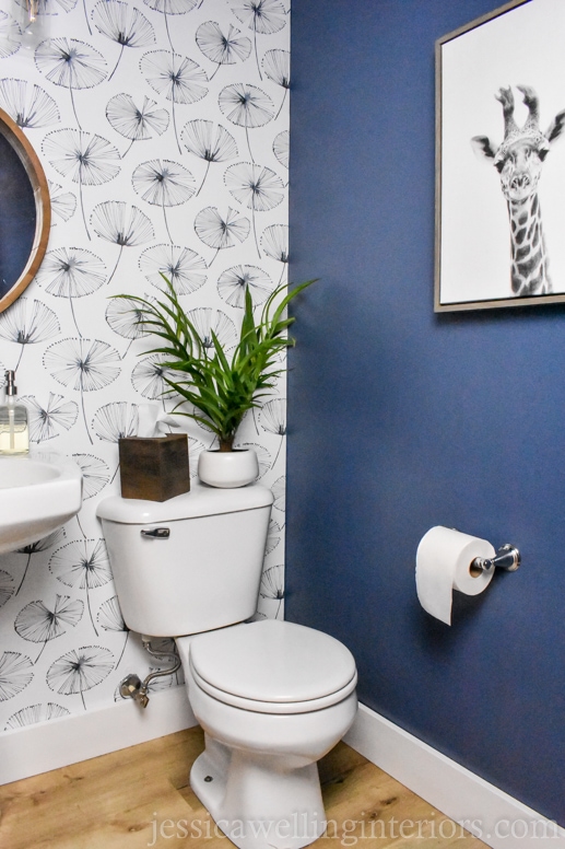 modern powder room with blue floral wallpaper accent wall