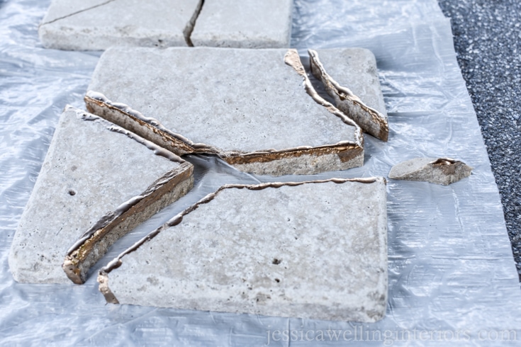 image of broken tile painted with gold leaf paint to make kintsugi coaster