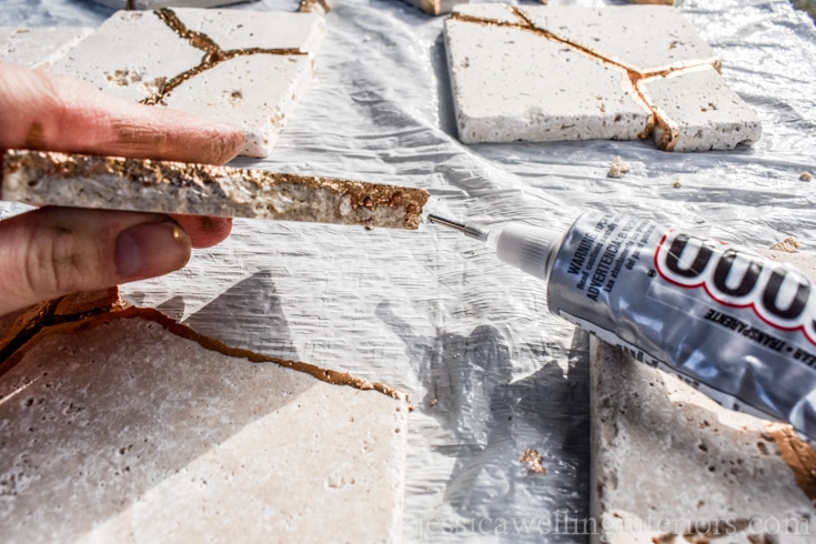 image of someone gluing broken tile together to make kintsugi coaster