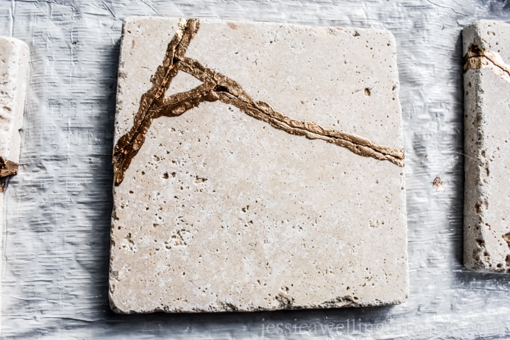 image of kintsugi coaster made from tile and gold leaf paint