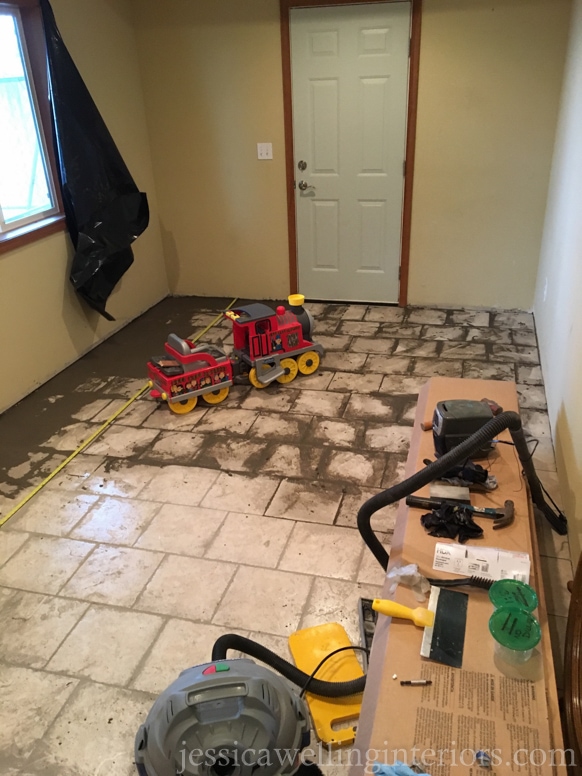 image of basement room with old tile before makeover