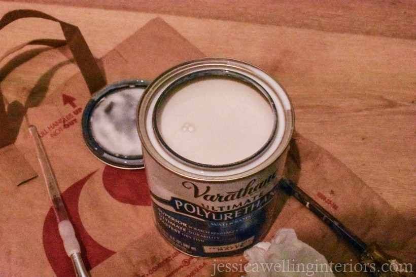 opened can of varathane polyurethane clear coat on the floor