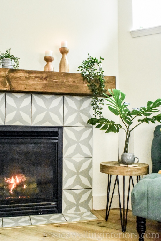 modern fireplace makeover with stenciled tiles in large modern pattern in grey and white