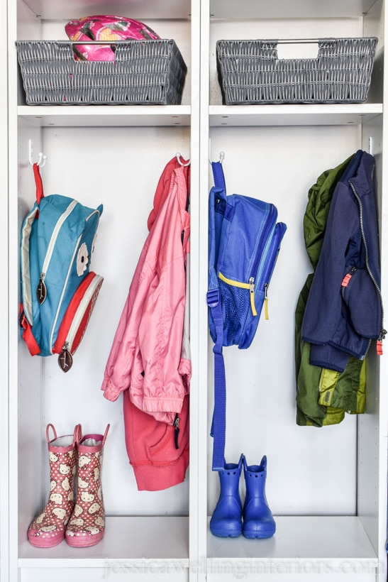 close-up of Ikea Billy bookcase backpack organizer hack. Hooks hold small children's backpacks and coats