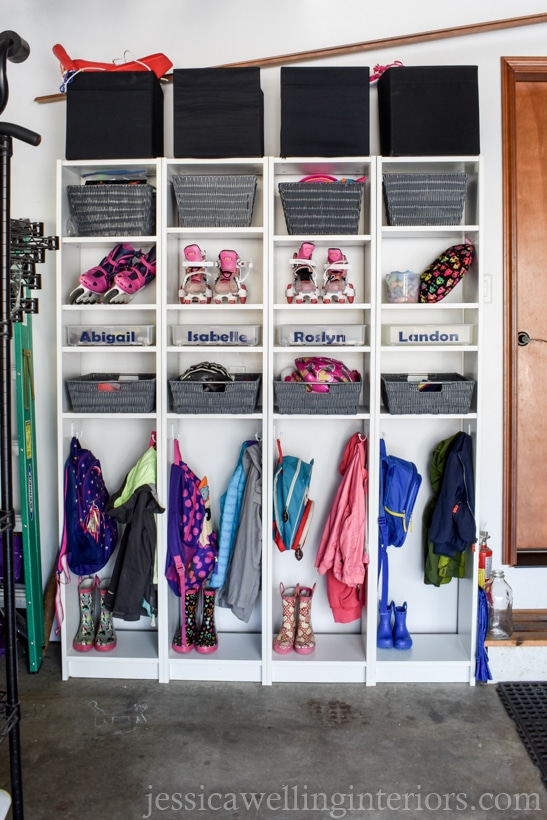four skinny Billy bookcases from Ikea lined up to make a mudroom backpack storage system