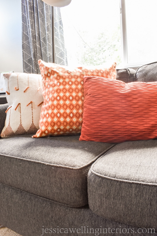 Fall living room decor with orange throw pillows