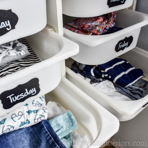 plastic ikea hack drawers with chalkboard labels for the days of the week. Individual outfits are in each drawer