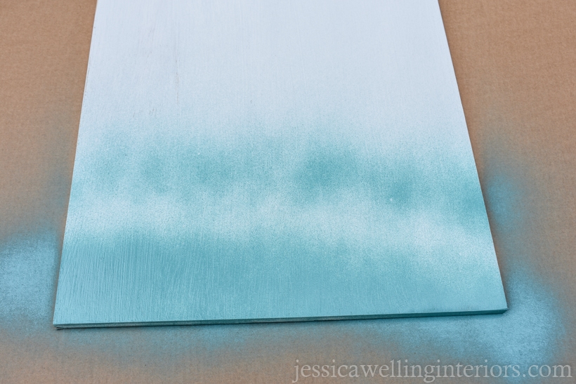 top of DIY floating desk for kids being spray-painted aqua blue