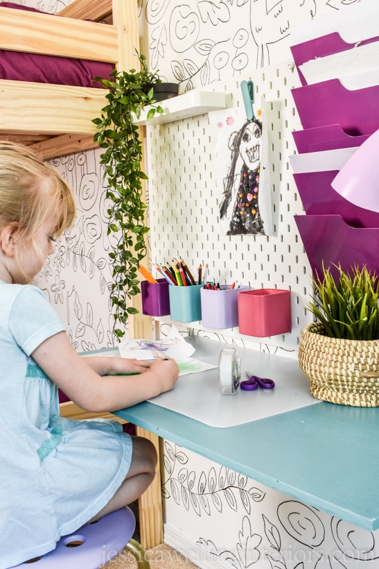 girls bedroom with little girl coloring at diy floating desk