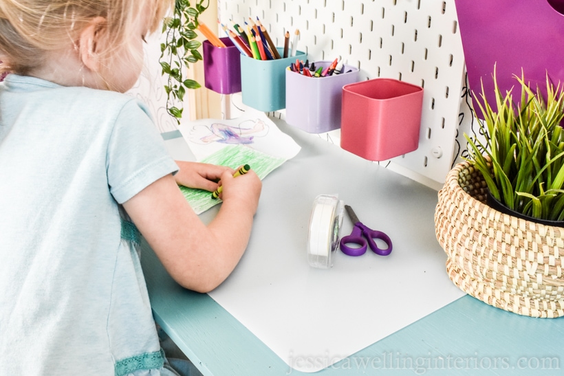 little girl working at floating kids desk