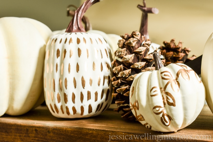 fall decor ideas for the mantel- wood mantel with painted pumpkins and pine cones