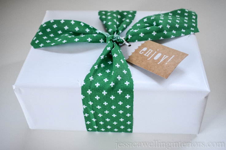 Christmas gift wrapping ideas: white paper gift tied with green patterned fabric ribbon