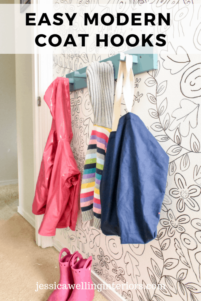 Easy Modern Coat Hooks: Aqua-painted wood coat rack on wall with children's coats and sweaters hanging from it