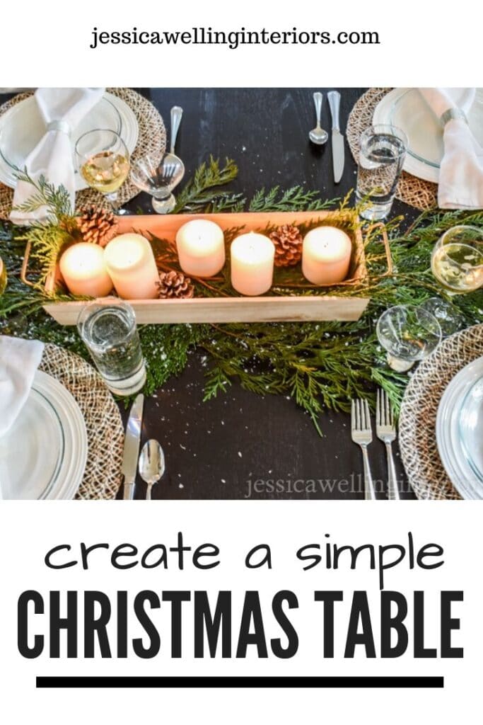 Create a Simple Christmas Table: black table set with cedar boughs and a wood tray of candles as a centerpiece