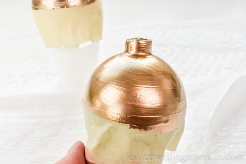 glass bauble wrapped with masking tape, and the top painted gold