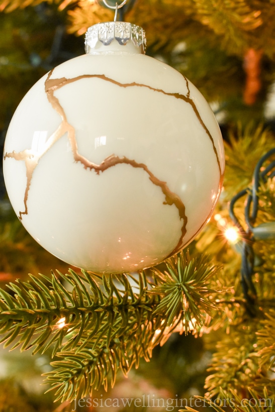 white diy kintsugi ornament hanging from a Christmas tree