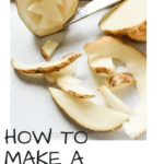 How to Make a Potato Stamp: image of russet potato being carved into a stamp with a pairing knife