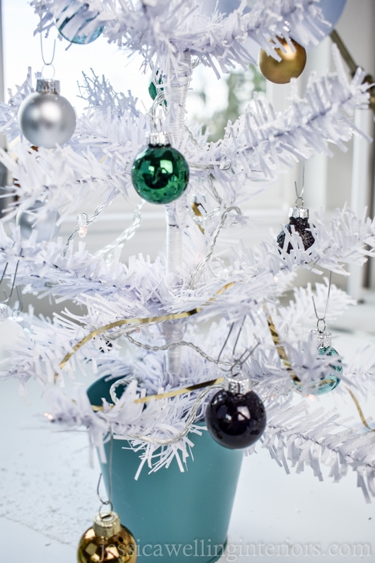 white flocked mini Christmas tree from Dollar Tree, with small baubles