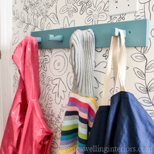 rack of coat hooks on diy wall mural