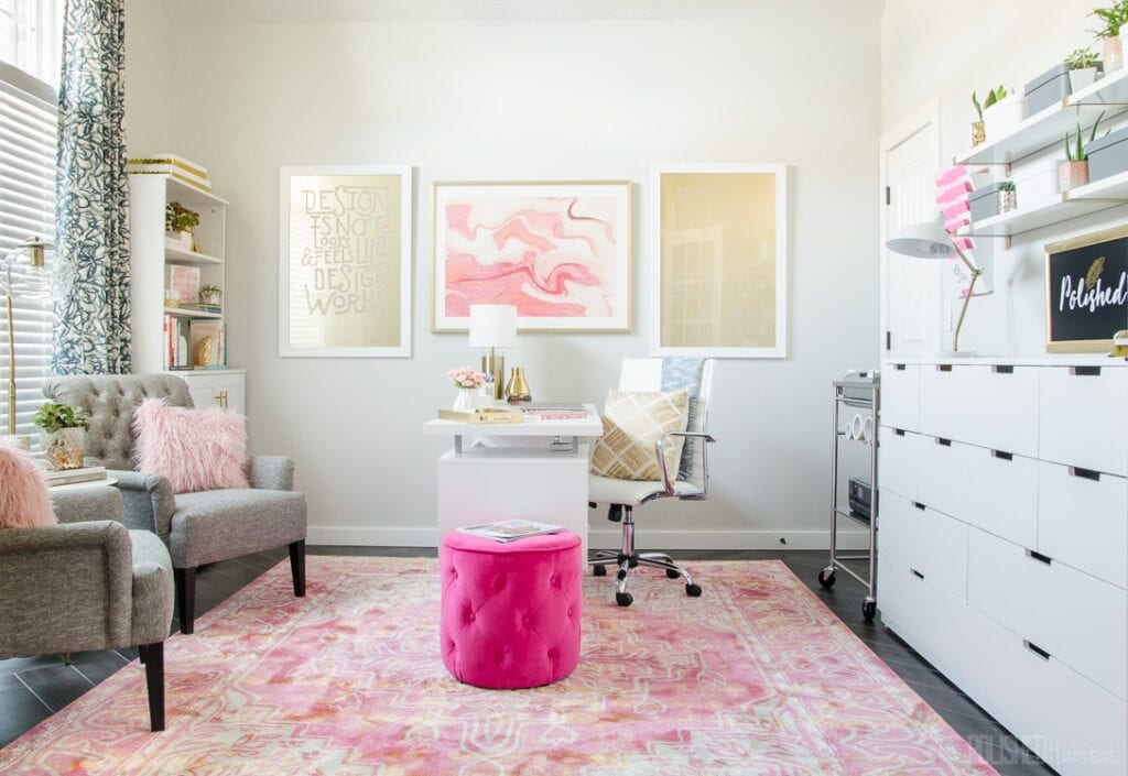 home office brightened up with white painted walls, white furniture, and bright pops of color