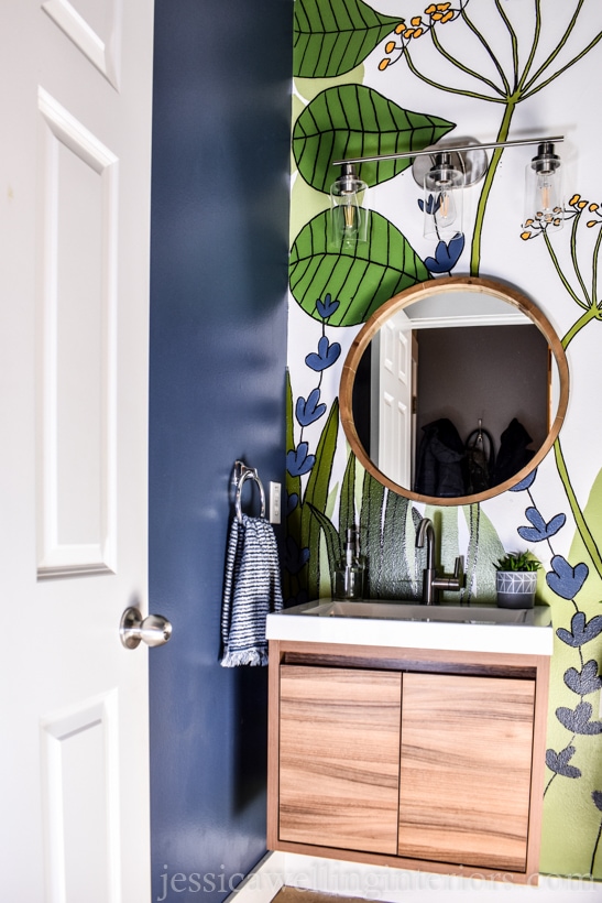 finished DIY accent wall botanical mural with wood vanity and mirror