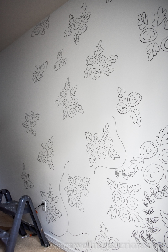 large wall with bunches of roses spaced out to look like a wallpaper print