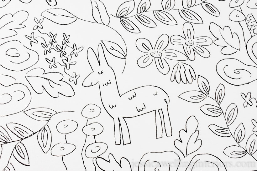 close-up of black and white floral print drawn on wall with an alpaca in a DIY wall mural