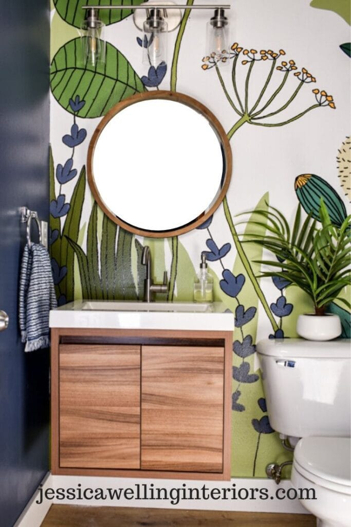 small bathroom with a bold botanical mural accent wall