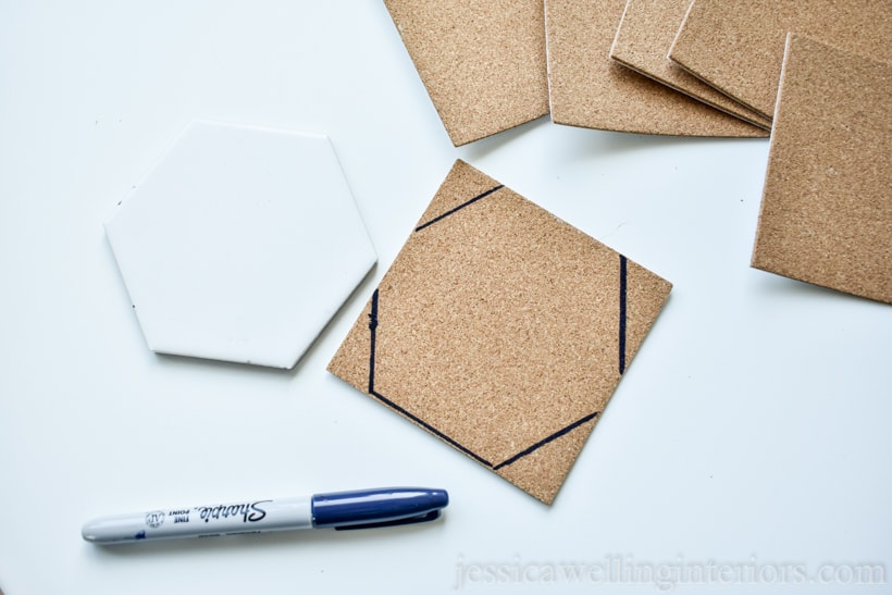 hexagon-shaped tile and square of self-adhesive cork backing with a hexagon traced on it to made a DIY coster