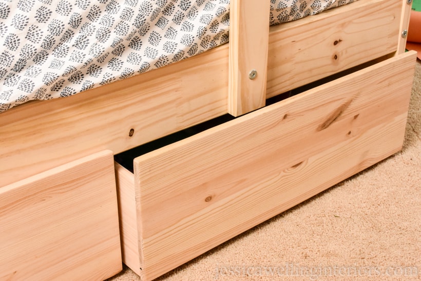 close-up of Ikea bunk bed with hacked under bed storage drawers