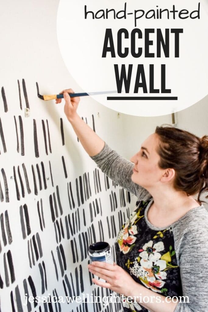 hand-painted accent wall: woman hand-painting an accent wall