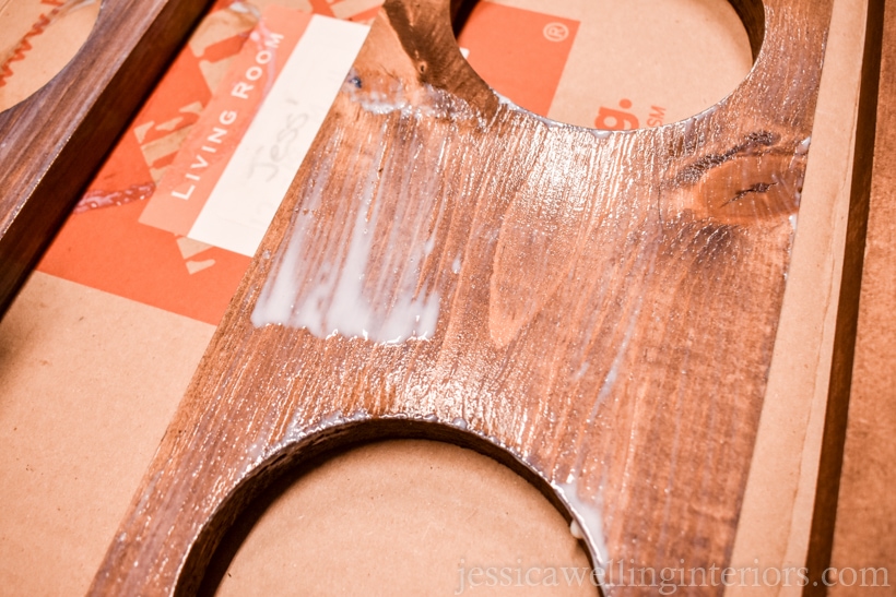 close-up of wet clear coat sealer on a n indoor living wall planter shelf