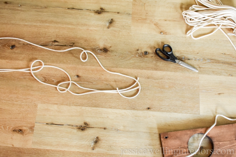 lengths of rope cut to hang a DIY vertical garden with faux hanging plants