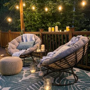 modern Boho deck with papasan chairs and string lights
