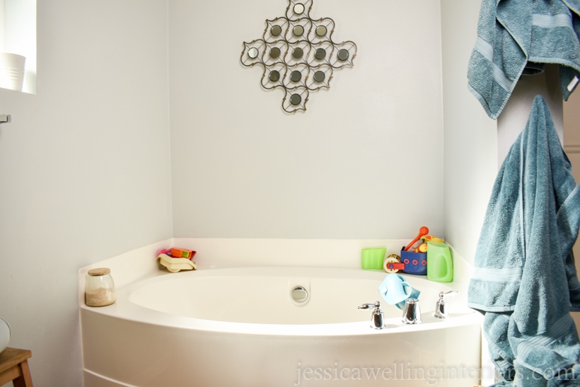 before photo of bathtub and surrounding walls